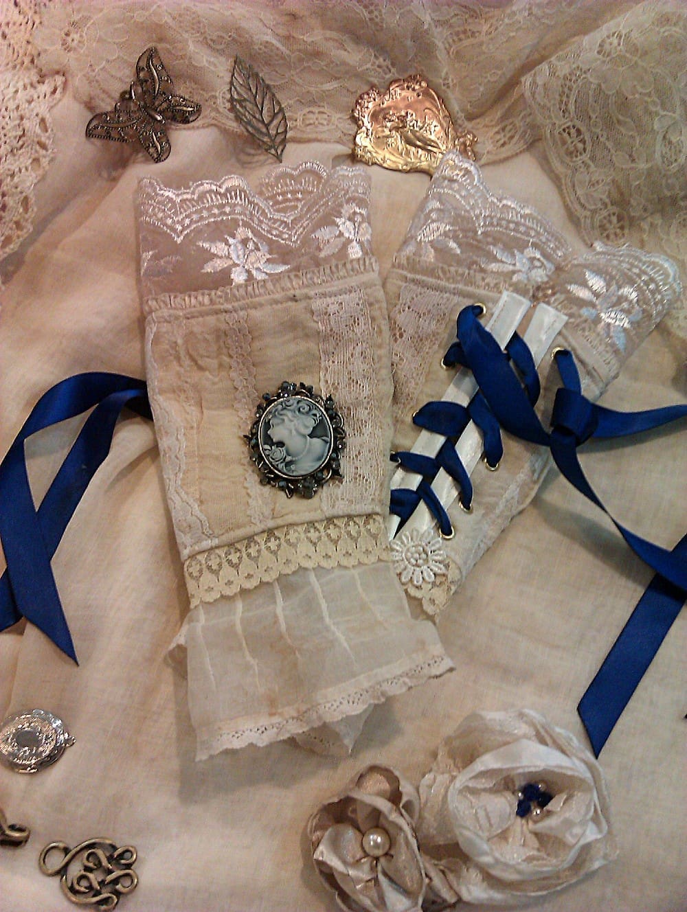 Victorian inspired lace and cameo arm cuffs with blue ribbons